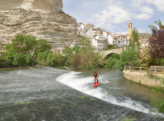  With the SUP board in the river 